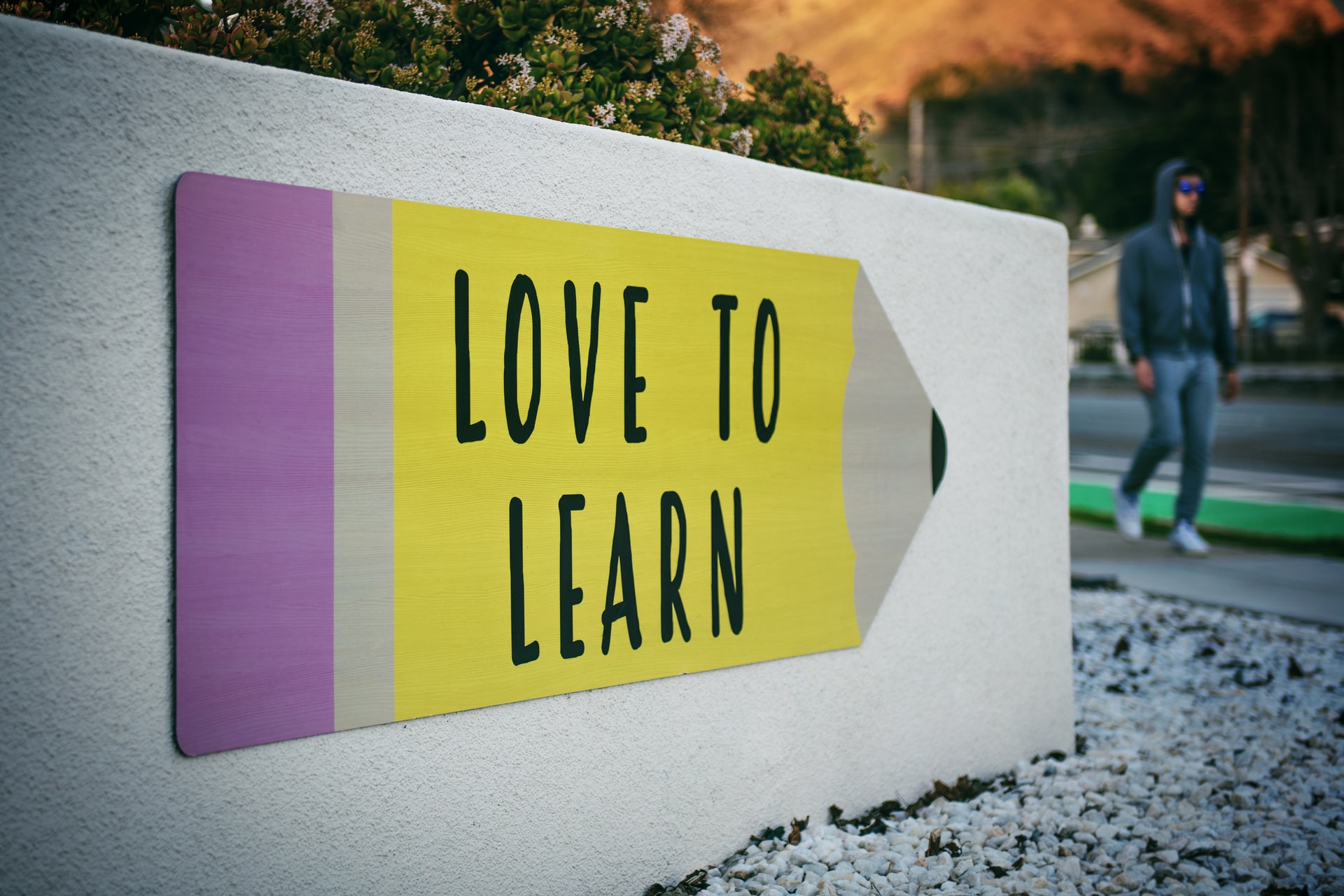 sign with text 'love to learn